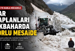 Bitlis'te mayıs ayında iş makinesini aşan karda yol açma mesaisi