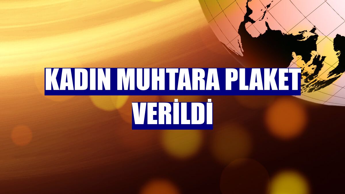 Kadın muhtara plaket verildi
