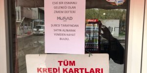 MÜSİAD Ağrı Şubesi ihtiyaç sahiplerinin veresiye defterlerindeki borçlarını ödedi